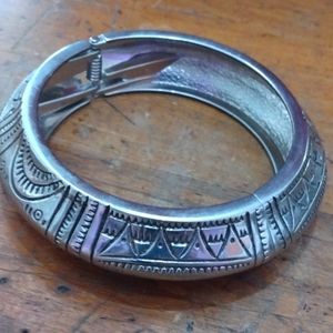 Hinged silver tone bangle bracelet
